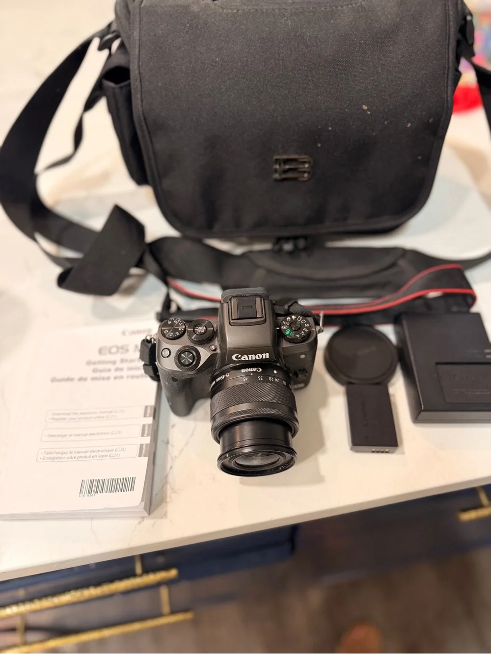 Canon Black Mirrorless Camera with Black Lens and Accessories